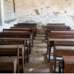 Empty Desks In A War Damaged School In Syria